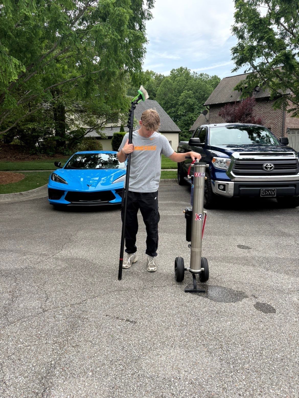 Blake on the route with his window cleaning gear